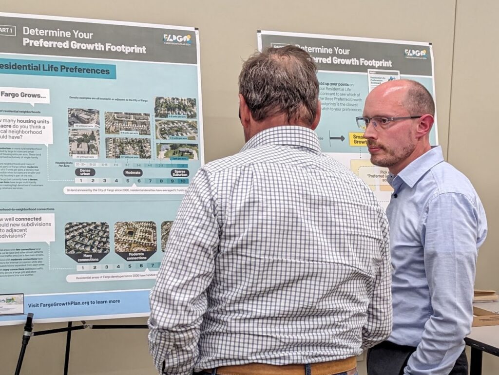CZB Partner Pete Lombardi and a community member at the Fargo, ND community meeting.