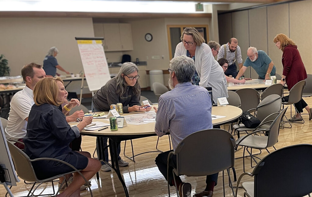 People around a breakout session table at the CZB Comprehensive Plan Community Meeting